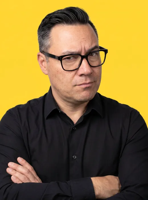 Steve, arms crossed and side-eyeing, on a yellow background